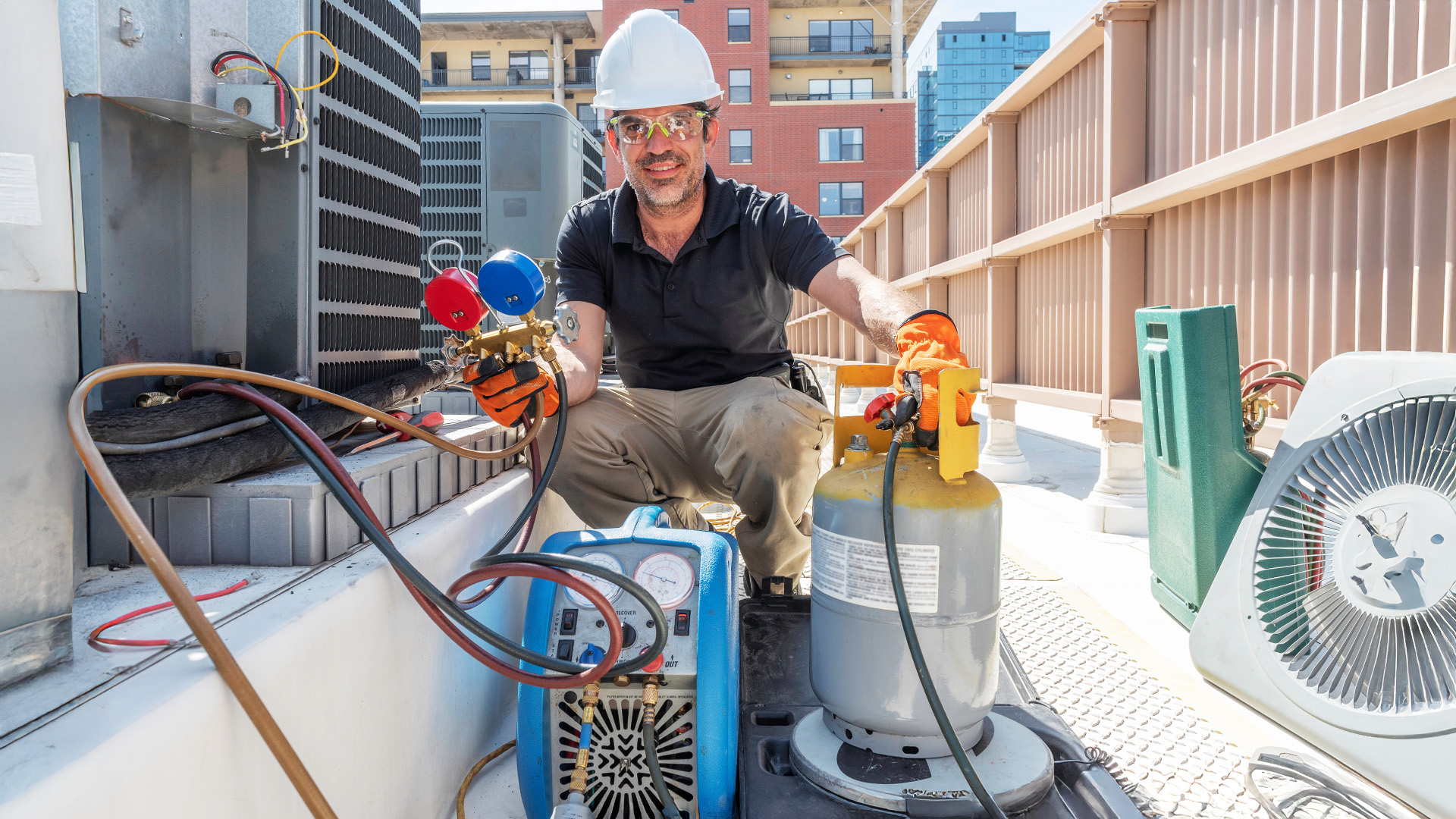 HVAC tech with Refrigerant recovery unit
